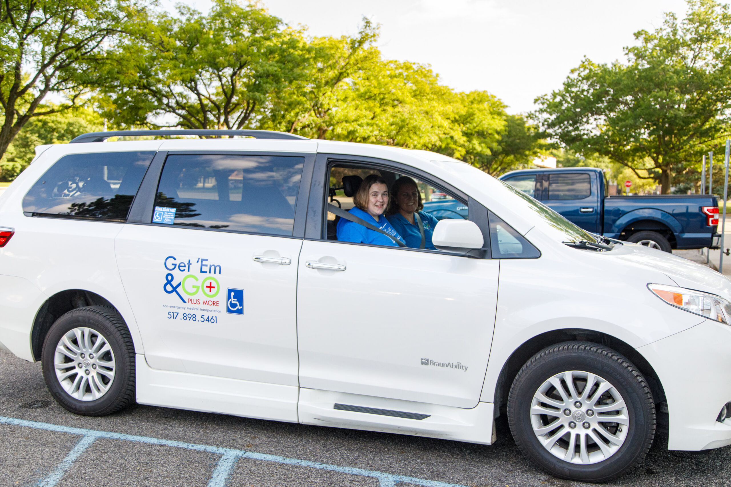 A Woman Driving A White Car